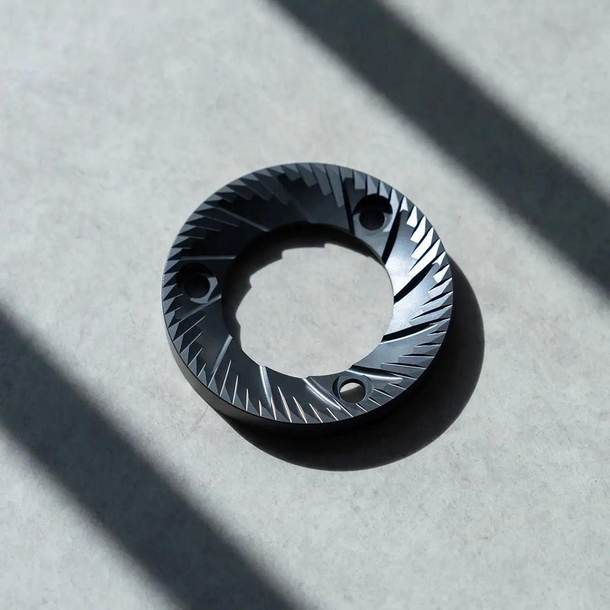 LeBrew Espresso Burr with textured design on a light gray background